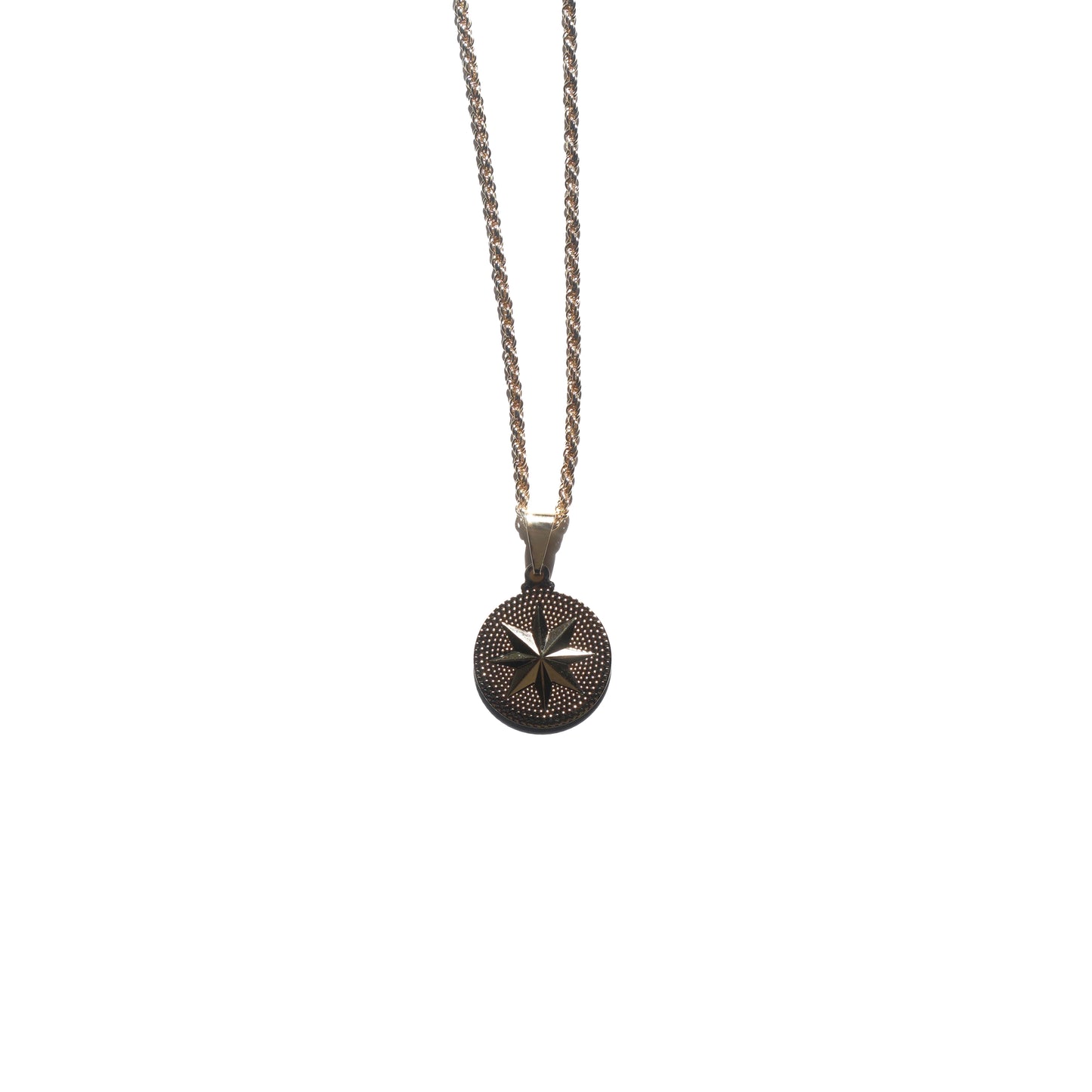 Circle charm with 8 point star on a rope chain necklace.