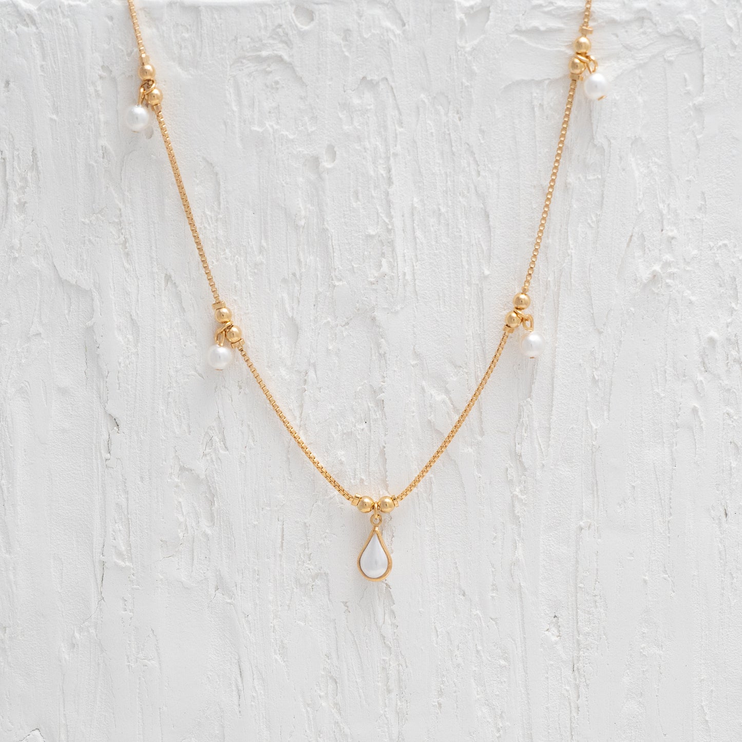 Elegant Pearl Tear Drop Gold Necklace, symbolizing timeless sophistication and delicate elegance.