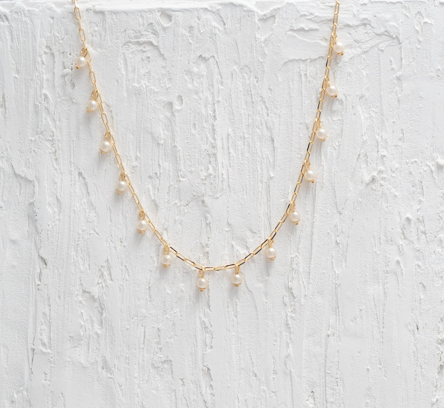 Timeless Pearl Drops Gold Necklace, blending strength and softness in a harmonious design