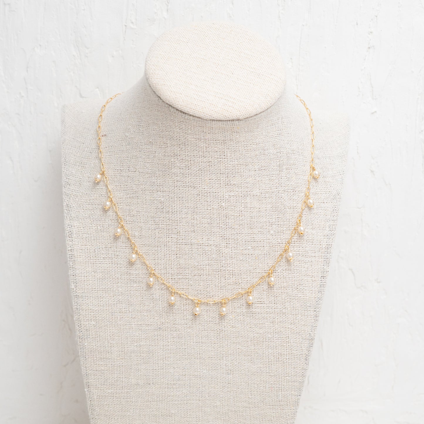 Luxurious Pearl Drops Necklace in Gold, a celebration of refined taste and simplicity.