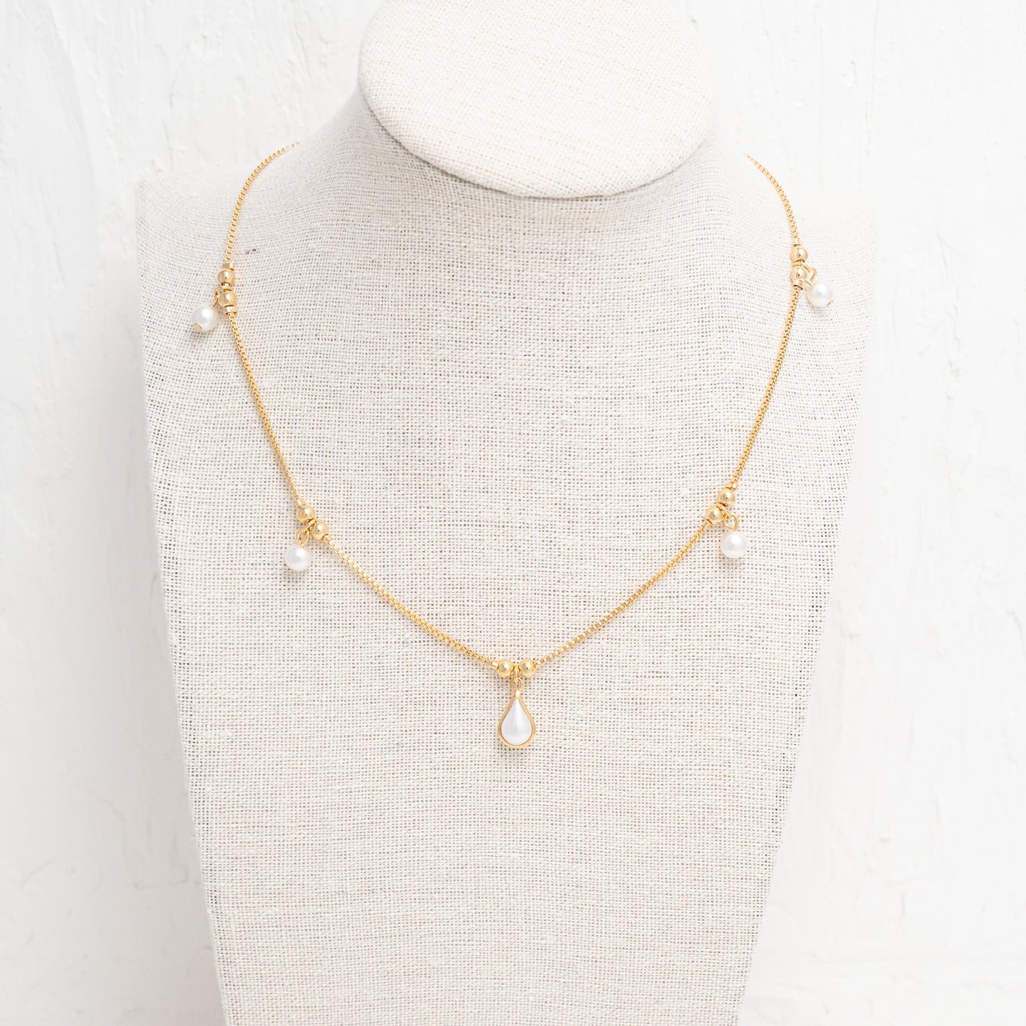 Classic Beauty with a Modern Refinement - Pearl Tear Drop Necklace in Gold Setting.