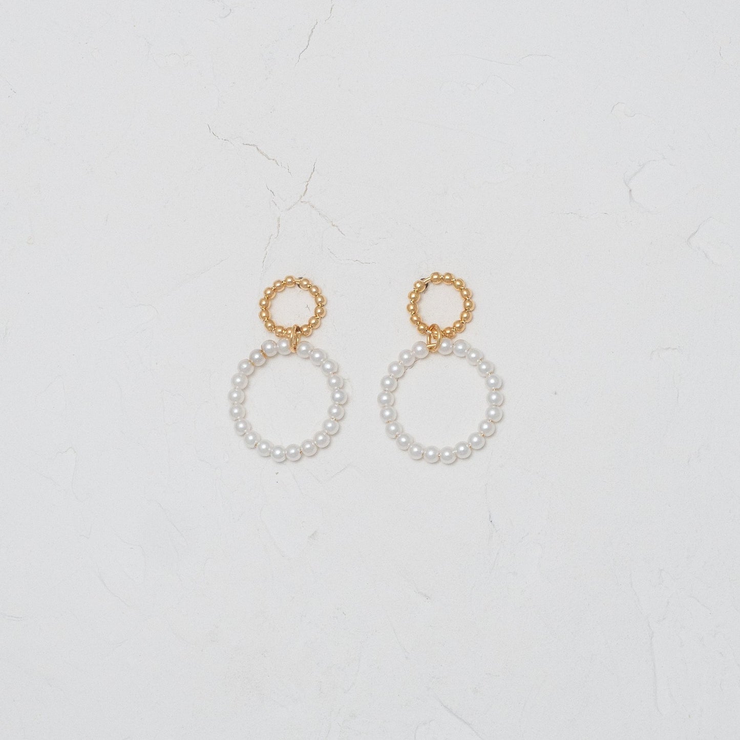 Elegant Pearl within Gold Circle Earrings, embodying classic charm and modern sophistication