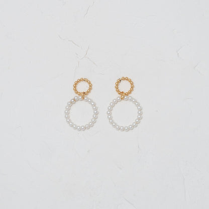 Elegant Pearl within Gold Circle Earrings, embodying classic charm and modern sophistication