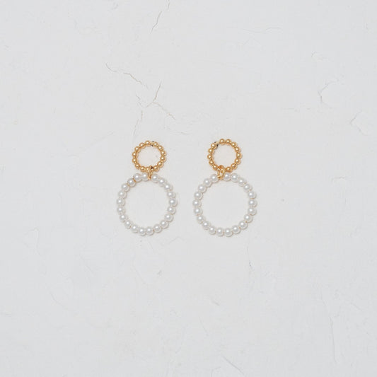 Elegant Pearl within Gold Circle Earrings, embodying classic charm and modern sophistication