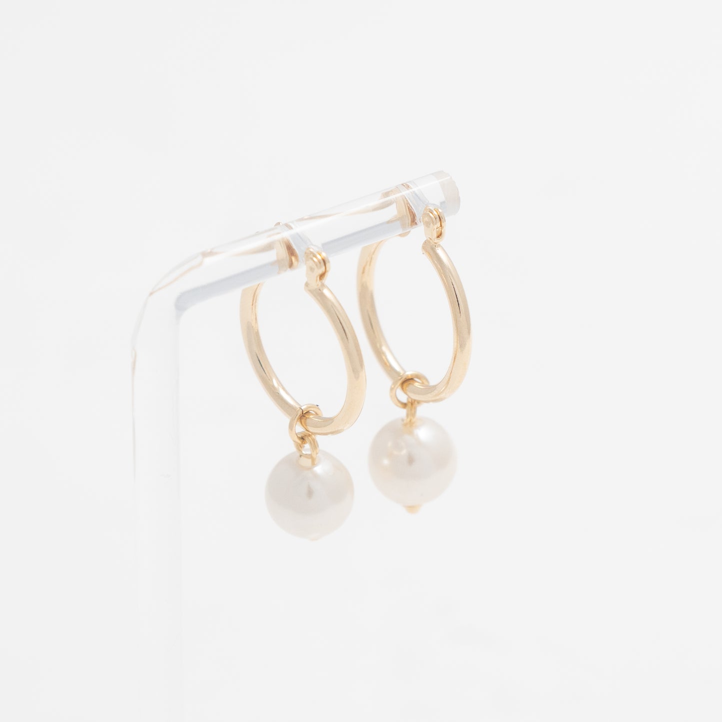 Versatile Gold Hoops with Dangling Pearl, embodying refined grace and modern sophistication.