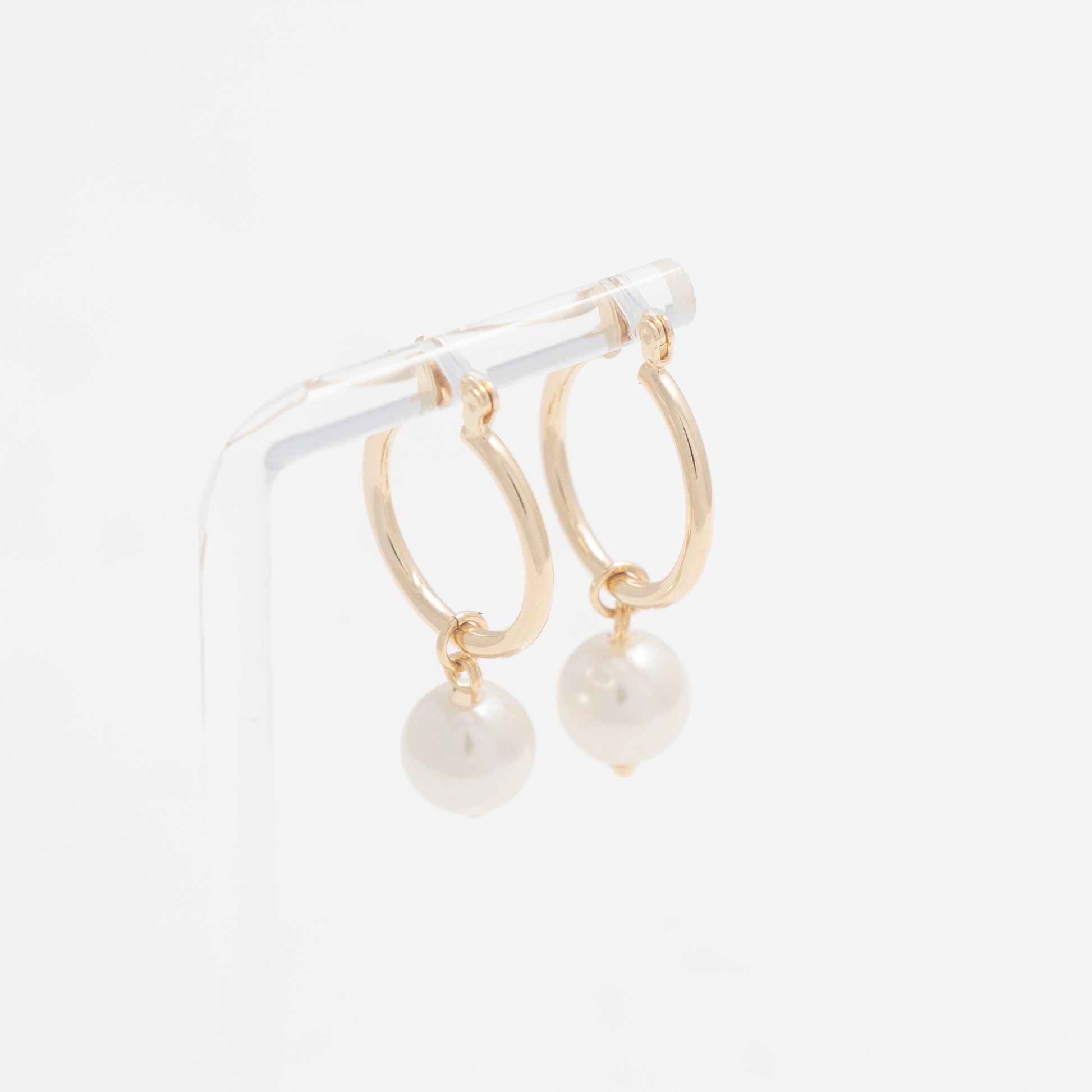 Versatile Gold Hoops with Dangling Pearl, embodying refined grace and modern sophistication.