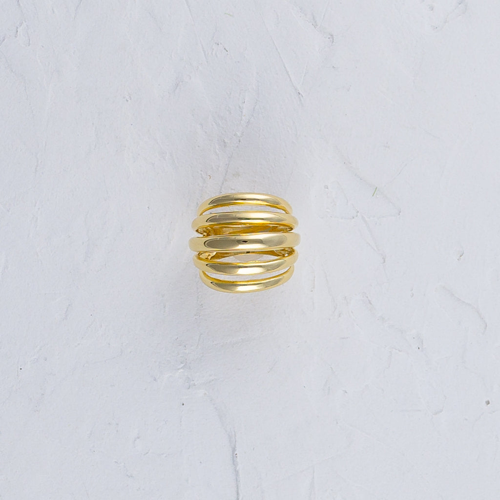 Ring showcasing intricate design on a white background.