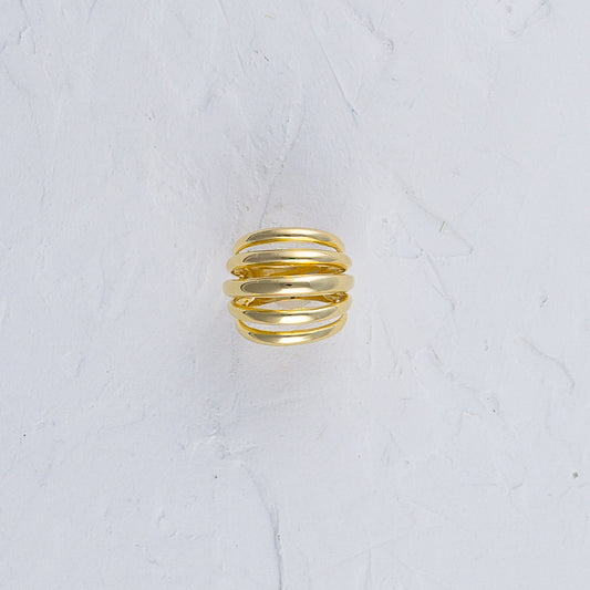 Ring showcasing intricate design on a white background.