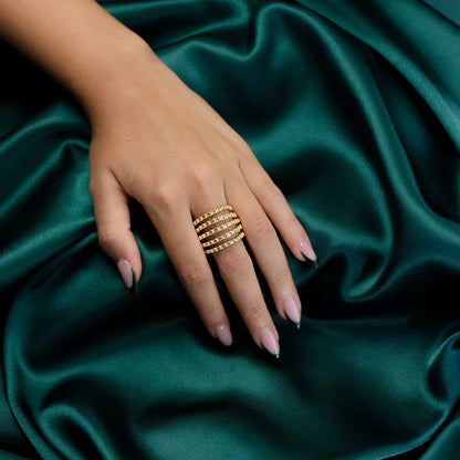 Aerial view of model wearing the Multiple Beaded Strand Gold Ring focusing on its design.